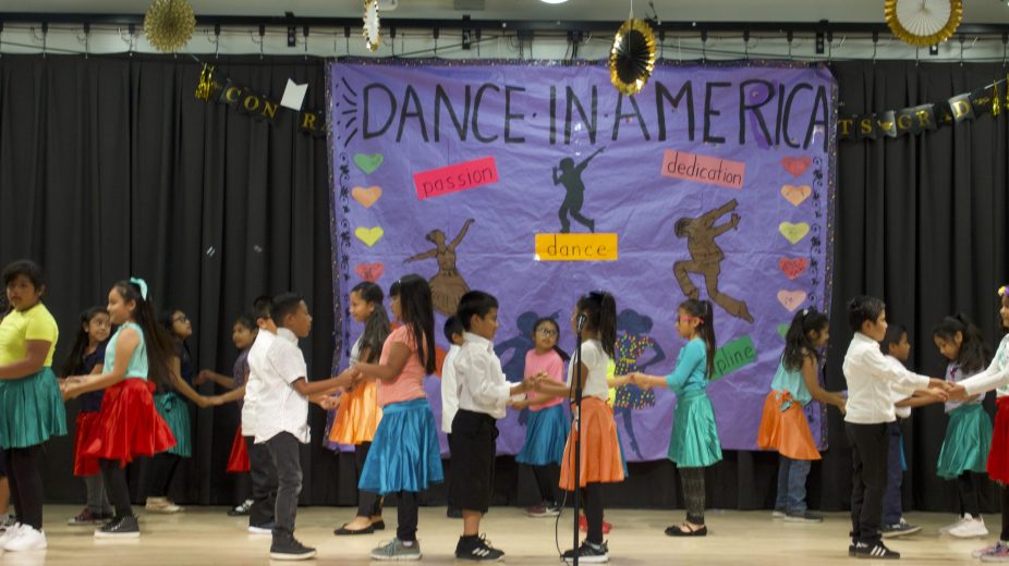 Children dancing with partners in a Dance in America program.